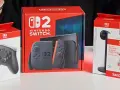Premiera Nintendo Switch: konsola, kontroler Pro, karta pamięci SanDisk z Mario i akcesorium.