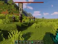 Zły omen w Minecraft! Zbliża się rajd najeźdźców. Gracz trzyma diamentowy miecz, gotowy do walki.