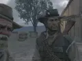 Dwóch kowbojów, jeden starszy z siwą brodą, drugi młodszy, w grze Red Dead Redemption 2 na PS5 w 60fps.