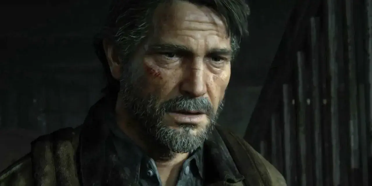 Zmęczony Joel z blizną na policzku, w brązowej kurtce, wygląda jakby czekał na wydarzenia z The Last of Us 3.