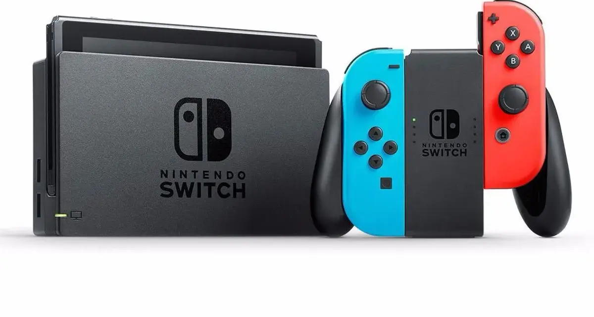 Konsola Nintendo Switch z dokiem i kontrolerami Joy-Con w kolorach niebieskim i czerwonym. Forza Nintendo Switch!