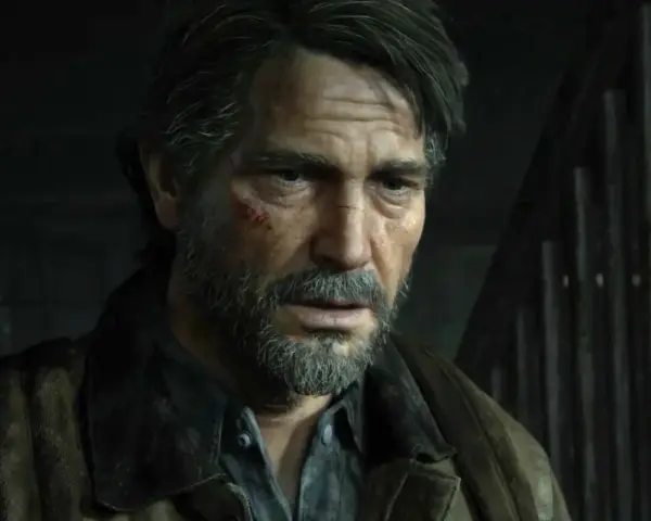 Zmęczony Joel z blizną na policzku, w brązowej kurtce, wygląda jakby czekał na wydarzenia z The Last of Us 3.