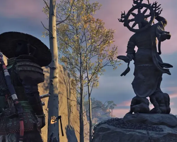 Samuraj przy Kapliczce Popiołów w Ghost of Tsushima. W tle posąg Buddy i drzewa.