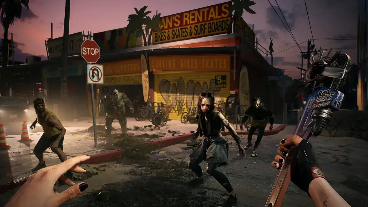 Dead Island 2 poradnik: gracze walczą z zombie na ulicy przed sklepem z wypożyczalnią rowerów i desek.